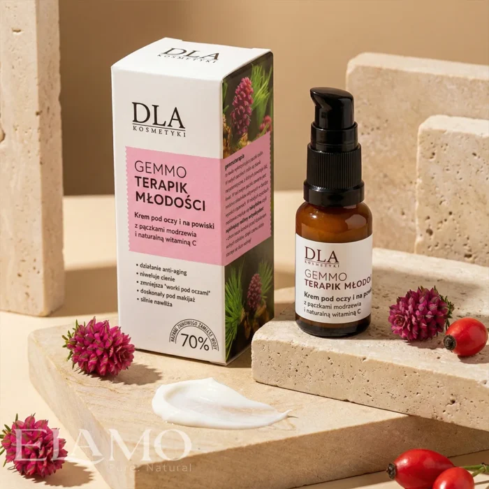 Krem Gemmoterapik Młodości stojący na kamiennych blokach w otoczeniu szyszek modrzewia i owoców dzikiej róży.