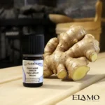 Mała buteleczka olejku imbirowego 5ml Florihana w saunie, oparta o dużą bulwę świeżego kłącza imbiru.