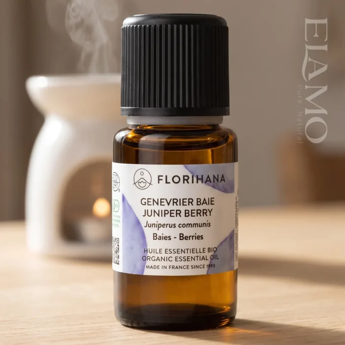 Butelka olejku jałowcowego Florihana na tle ceramicznego kominka aromaterapeutycznego do dyfuzji