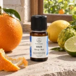 Buteleczka SOLIS Florihana wśród pomarańczy, cytryny, bergamotki i limonki na kamiennym blacie
