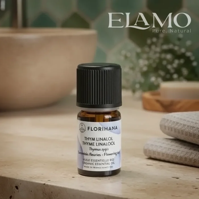 Florihana olejek tymiankowy linalol na kamiennym blacie w scenerii SPA – naturalny klimat